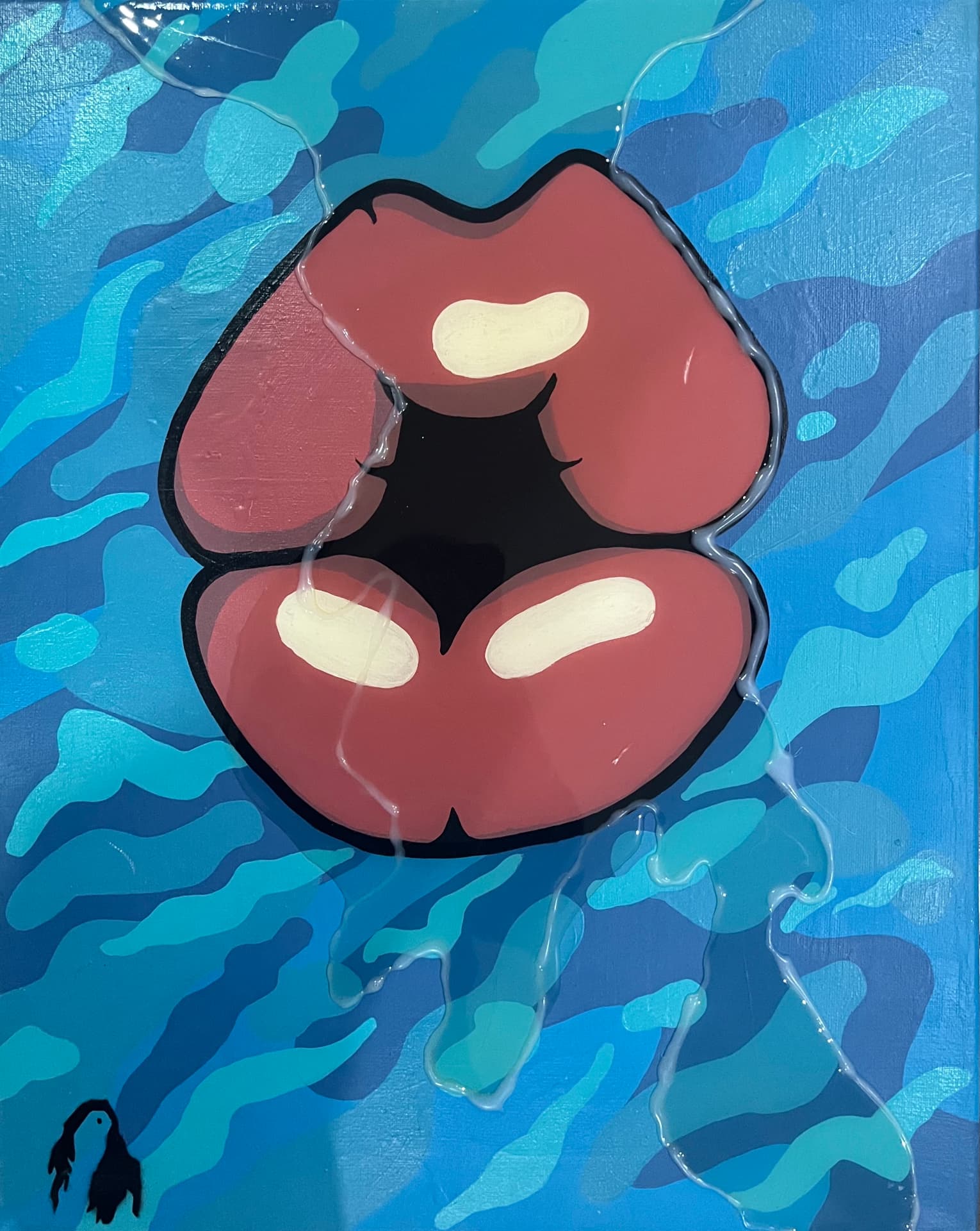 Bouches: “Kiss Me Blue” — glossy red lips on a camouflage blue background